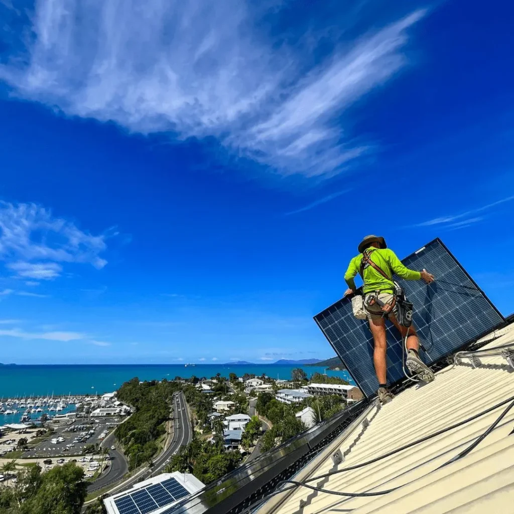 Green Energy Technologies solar installers working on a rooftop, demonstrating commitment to quality installation.